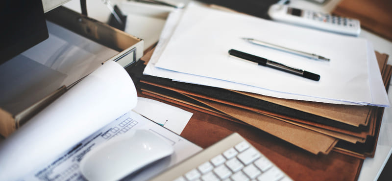 Organized desk with documents and laptop